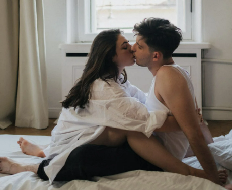 man-and-woman-sitting-while-kissing